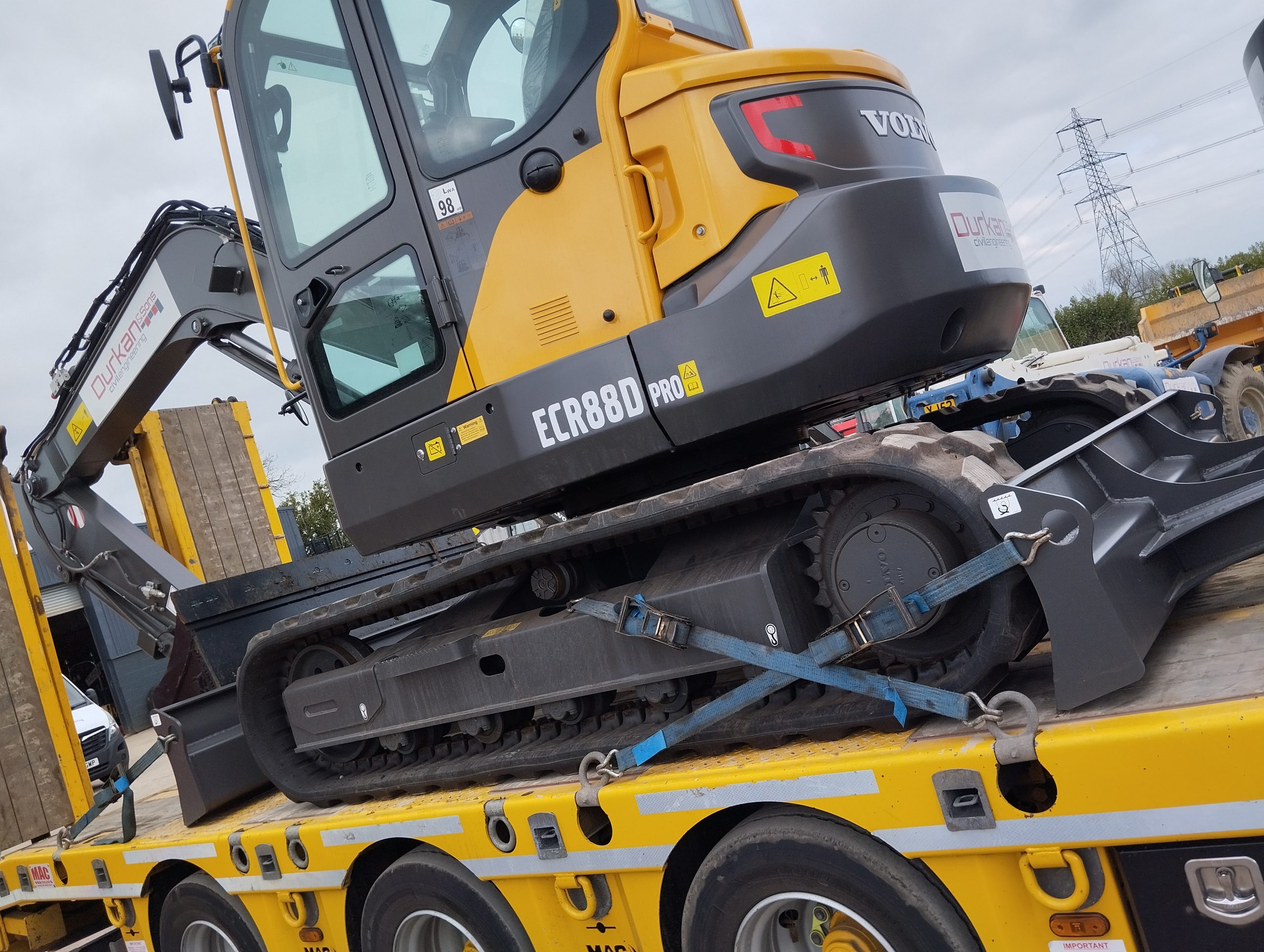Volvo ECR88D Pro 8T excavator secured on a low loader
