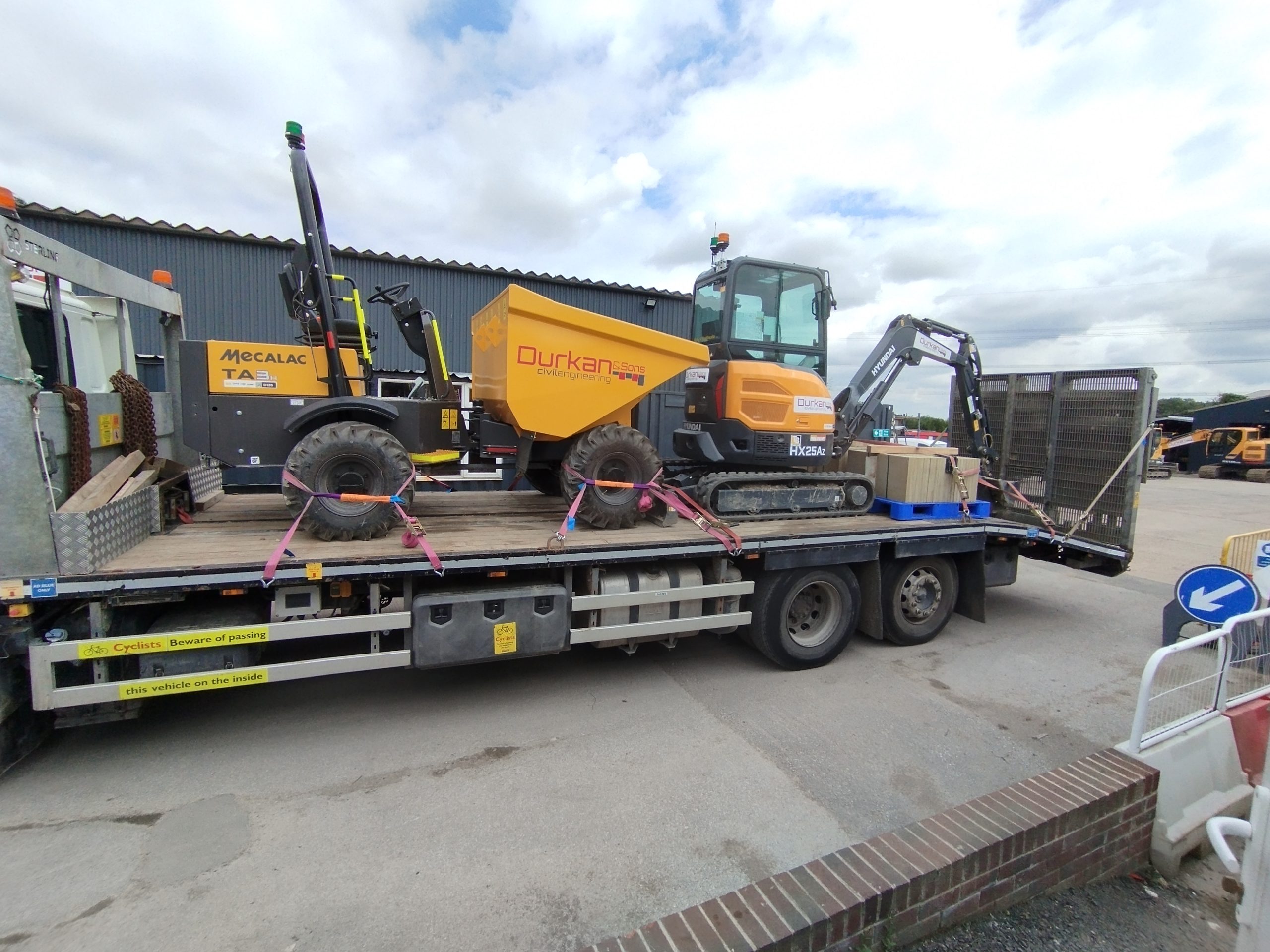Mecalac dumper and excavator secured on a transport vehicle at the Durkan & Sons yard